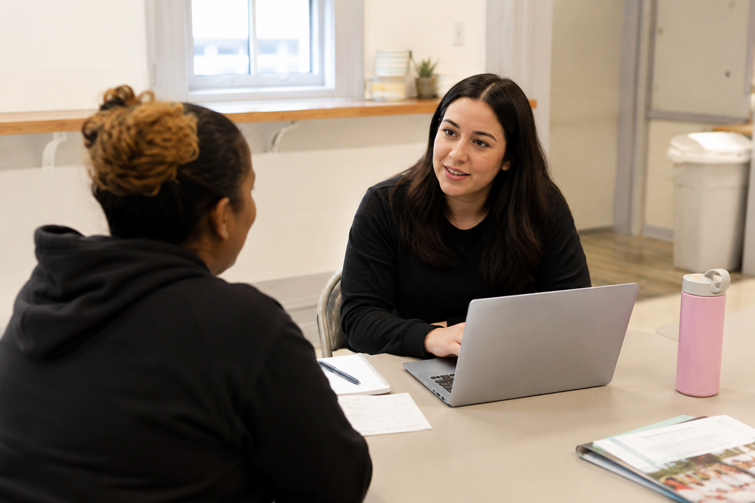 Case manager working with a client at a nonprofit office